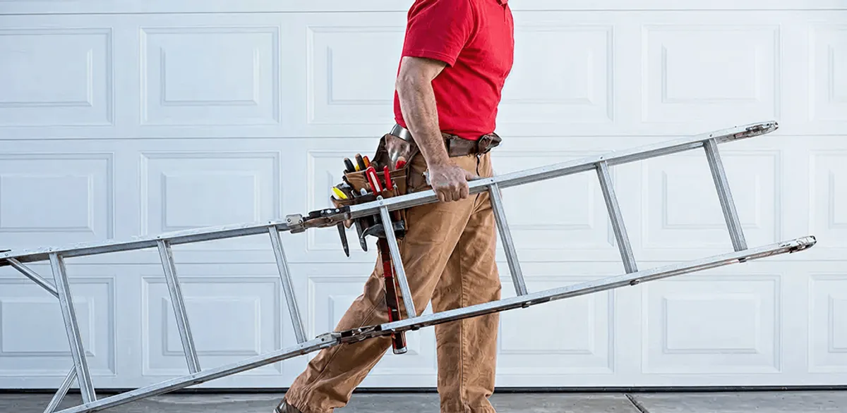 Garage door repair technician arriving with tools and ladder in Newark, NJ